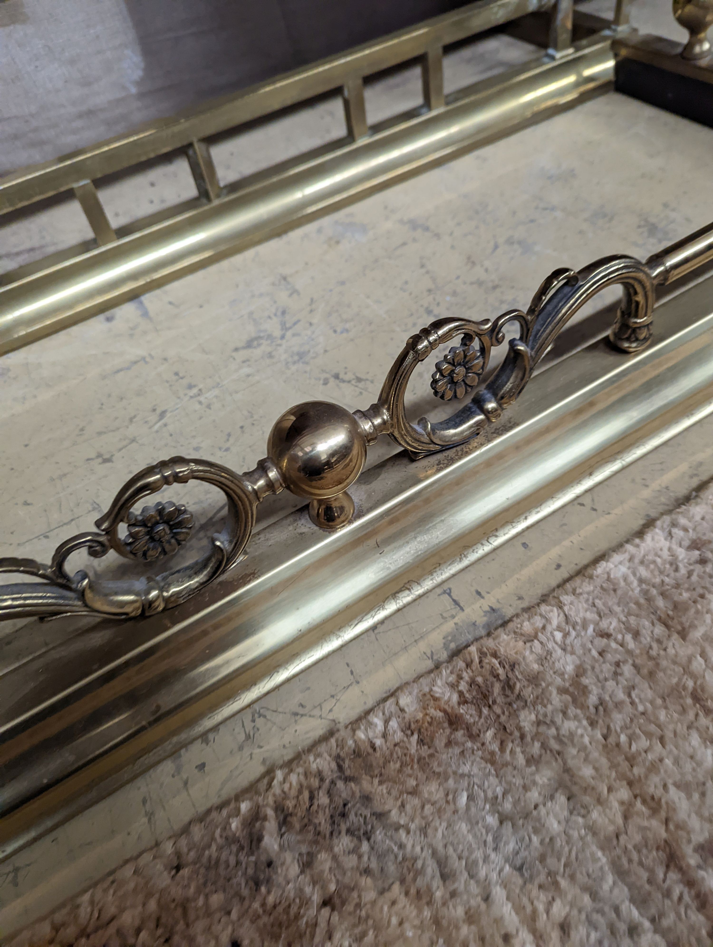 Two Edwardian and later brass fenders, one telescopic